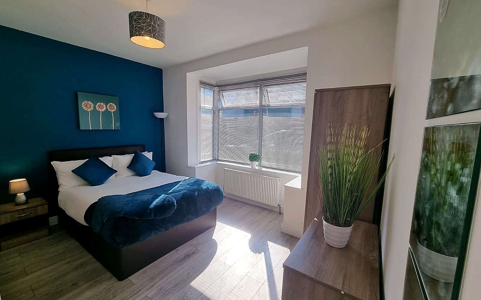 Finished shared-house bedroom with a bay window, operated by Dream Work Property